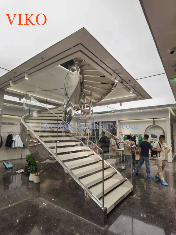 VIKO's Large Shopping Mall Uses High-end and Atmospheric Curved Staircases with Outer Stainless Steel Plates